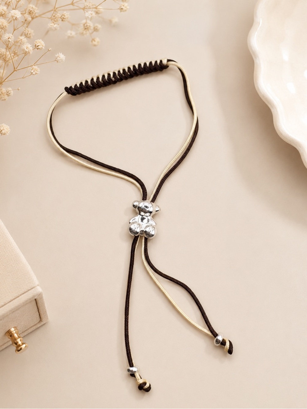 Bold Bear bracelet with two intertwined M And Cream 925